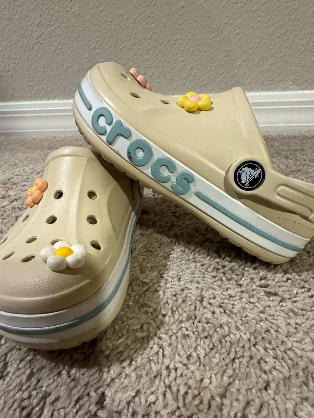 CROCS Kids Cream Clogs with Pink Yellow and White Flower Charms